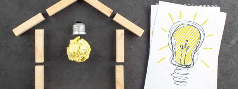 top-view-idealight-bulb-house-shaped-wood-blocks-idealight-bulb-drawing-notepad-black